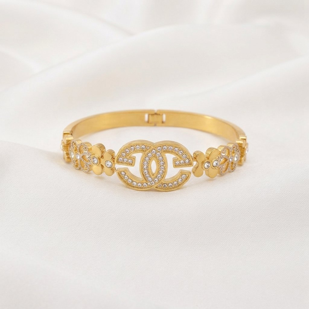 Gold Stainless Steel Interlocking C Floral Crystal Bangle Bracelets Gold Stainless Steel Interlocking C Floral Crystal Bangle Bracelets (Multiple Designs) - Image 1